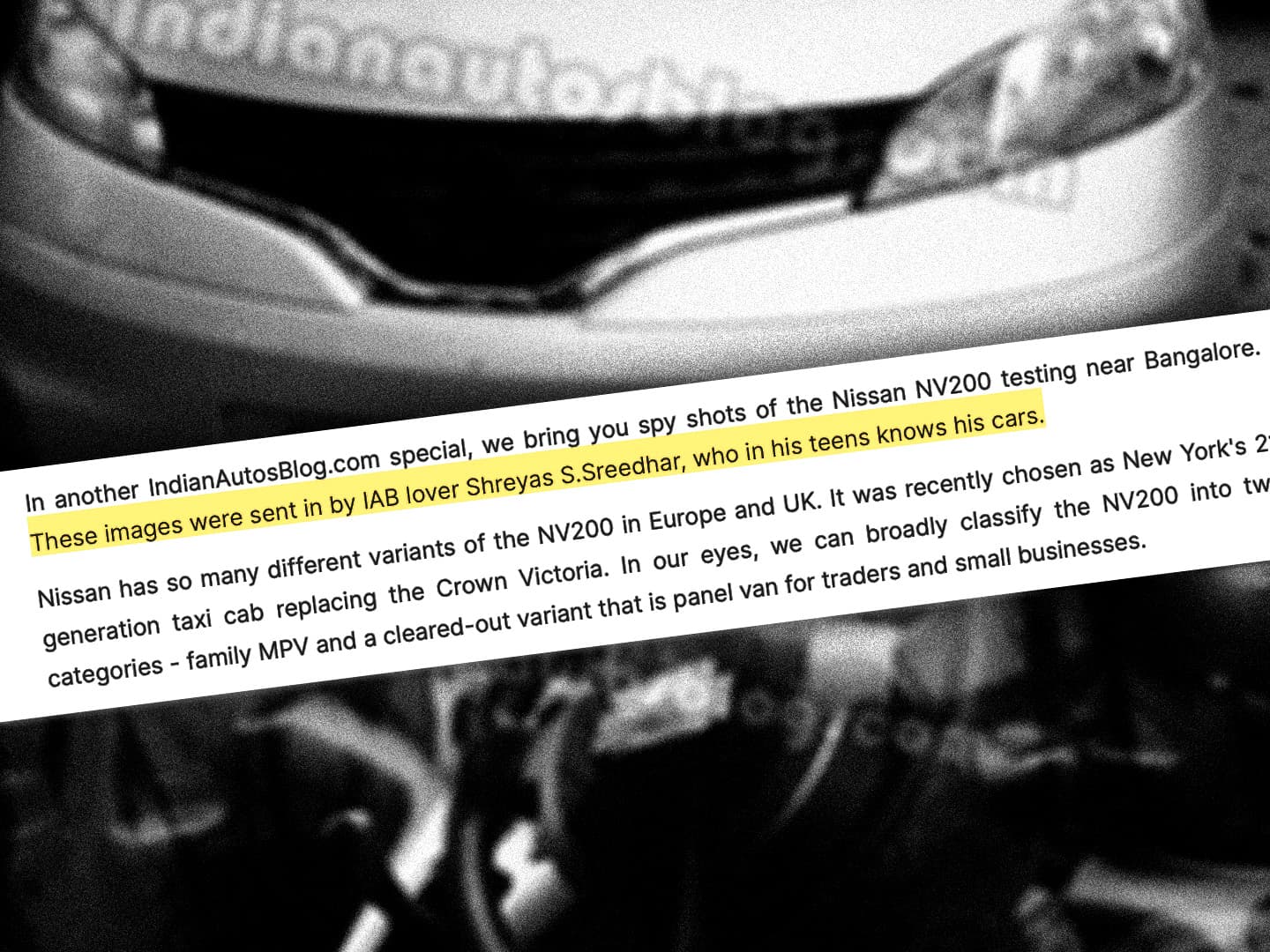 A grainy black-and-white photograph of a van's front end, with an angled white band of body copy across the middle.