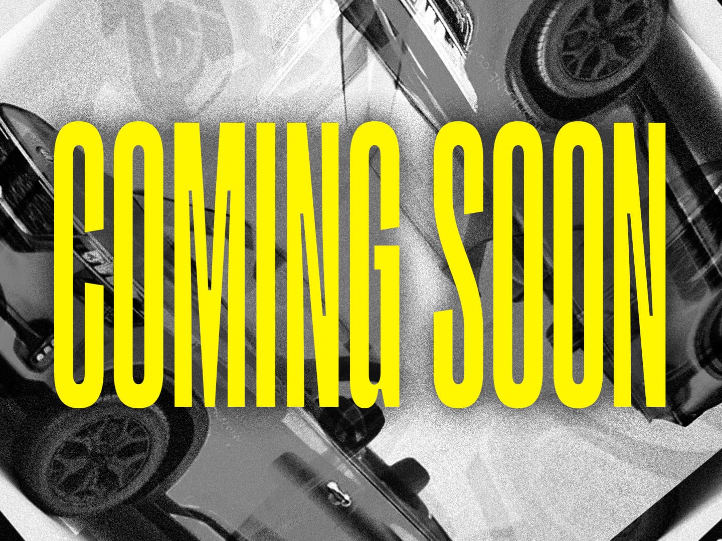 Bold yellow condensed capitals reading COMING SOON across a high-contrast black-and-white photograph of a car.